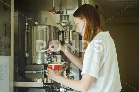 Caucasian Woman Pouring Hot Water Into Bowl