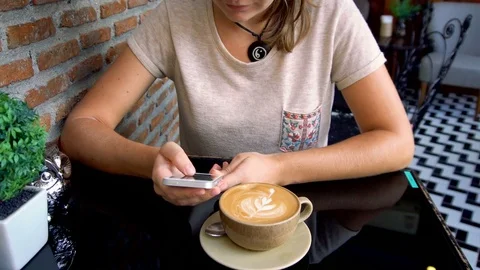 Caucasian Woman Texting on Phone and Drinking Coffee Stock Footage