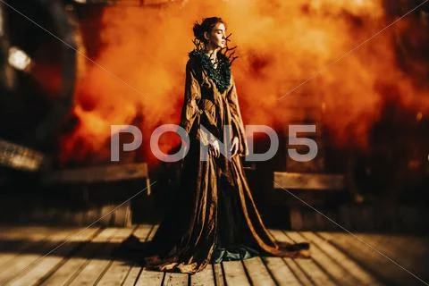 Caucasian woman wearing branch necklace and dress on stage Stock Photos