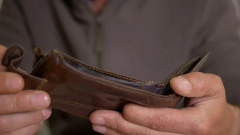 Caucasian worker with a missing finger opening  hes empty wallet Stock Footage 114348121