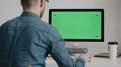 Caucasian worker typing on keyboard and looking at green screen Stock Footage 62023243