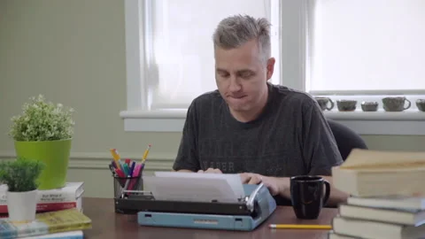 Caucasian Writing on Typewriter Stock Footage 150459782