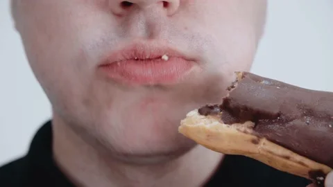 Caucasian young man eats cake with pleasure. Stock Footage 145612315