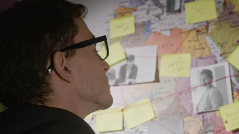 Caucasian young man looking at wall map with strings Stock Footage 181826261