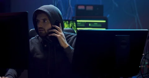 Caucasian young man software developer and programmer in a hood working at night Stock Footage 124338631