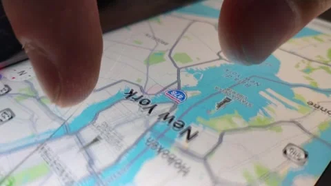 Caucasian young man using gps app on iphone. iphone maps app on the screen. Video stock 245473247