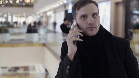 Caucasian young men using smartphone at shopping mall. Portrait Video stock 74161745