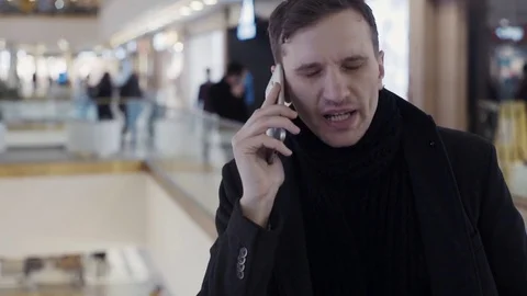Caucasian young men using smartphone at shopping mall. Portrait Stock Footage 74162044