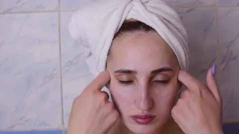 Caucasian young model without makeup, doing a facial massage using a Gua Sha sto 스톡 동영상 180496663
