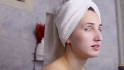 Caucasian young model without makeup, doing a facial massage using a Gua Sha sto Stock Footage 180499323