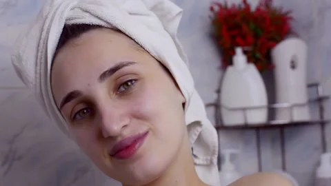Caucasian young model without makeup, doing a facial massage using a Gua Sha sto Stock Footage 180499486