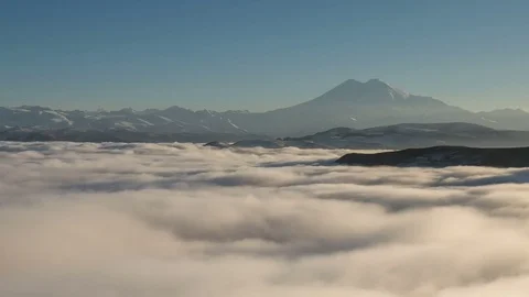 Caucasus. The formation of winter clouds above the volcano Elbrus Stock Footage 70301145