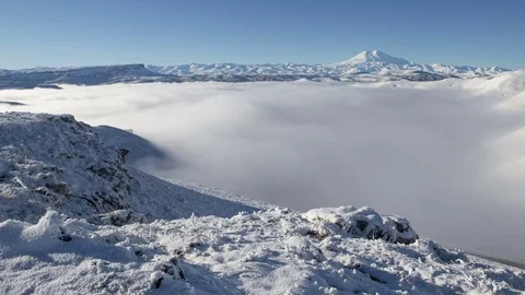 Caucasus. The formation of winter clouds above the volcano Elbrus Stock Footage 70408309