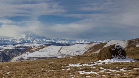 Caucasus. The formation of winter clouds above the volcano Elbrus Stock Footage 70497766