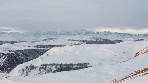 Caucasus. The formation of winter clouds above the volcano Elbrus Stock Footage 72589444