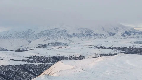 Caucasus. The formation of winter clouds above the volcano Elbrus Stock Footage 72589453