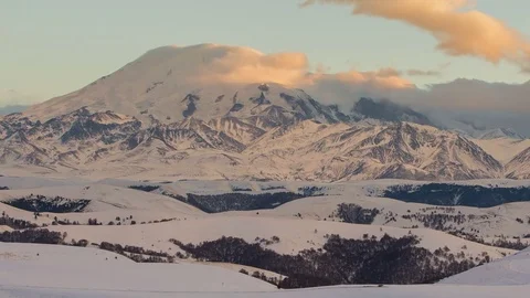 Caucasus. The formation of winter clouds above the volcano Elbrus Stock Footage 72612678