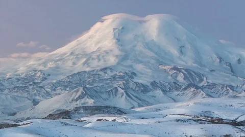 Caucasus. The formation of winter clouds above the volcano Elbrus Stock Footage 72616227
