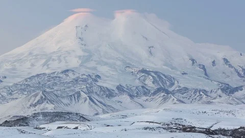 Caucasus. The formation of winter clouds above the volcano Elbrus Stock Footage 72617101