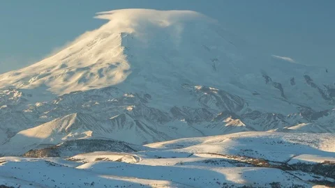 Caucasus. The formation of winter clouds above the volcano Elbrus Stock Footage 72617983