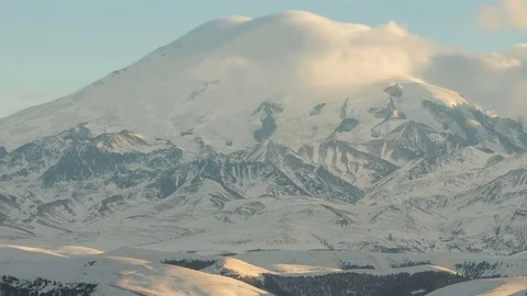 Caucasus. The formation of winter clouds above the volcano Elbrus Stock Footage 72619165