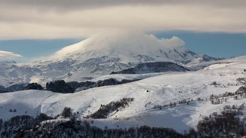 Caucasus. The formation of winter clouds above the volcano Elbrus Stock Footage 72622581