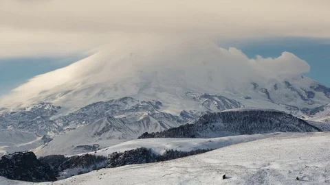 Caucasus. The formation of winter clouds above the volcano Elbrus Stock Footage 72622621