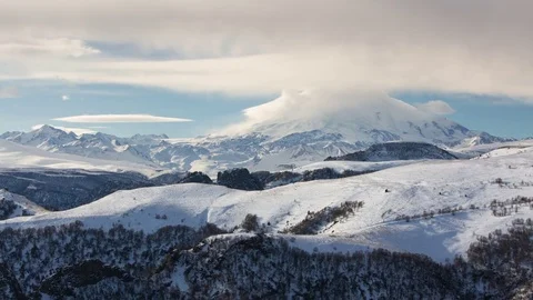 Caucasus. The formation of winter clouds above the volcano Elbrus Stock Footage 72622943