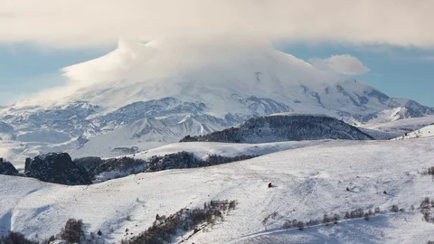 Caucasus. The formation of winter clouds above the volcano Elbrus Stock Footage 72623057