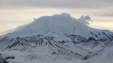 Caucasus. The formation of winter clouds above the volcano Elbrus Stock Footage 72625456