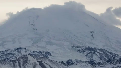 Caucasus. The formation of winter clouds above the volcano Elbrus Stock Footage 72625533