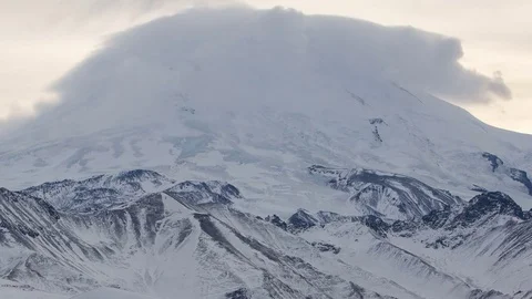 Caucasus. The formation of winter clouds above the volcano Elbrus Stock Footage 72626419
