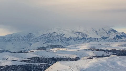 Caucasus. The formation of winter clouds above the volcano Elbrus Stock Footage 72627035