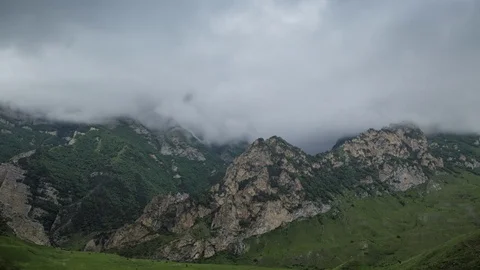 Caucasus mountains,  rain clouds slowly cover the stony mountain slopes. 動画素材 78088363