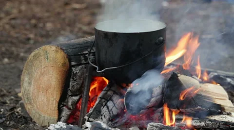 Cauldron on burning campfire Stock Footage 65743842