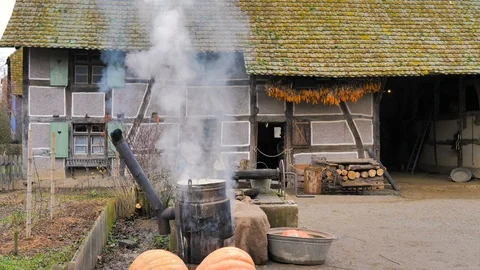 Cauldron cooking pumpkin and vegetables outside a farm Stock Footage 124473838