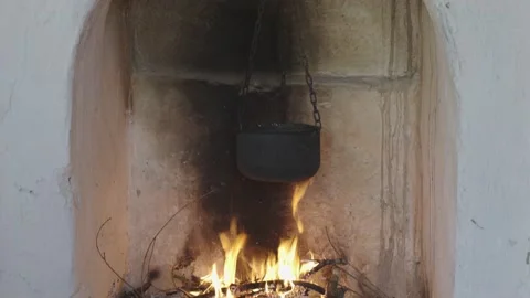 Cauldron on fire at home fireside Stock Footage