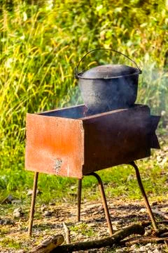 Cauldron on grill Stock Photos