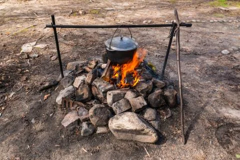 Cauldron over campfire. 写真素材