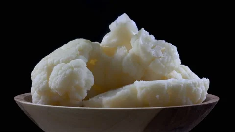 Cauliflower chunks rotate in 4K Stock Footage 138276246