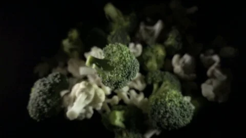 Cauliflower falls in the air on a black background. slow motion. Stock Footage 82854537