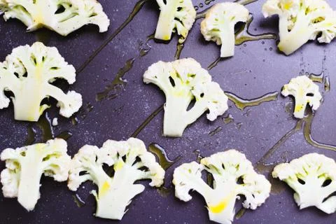 Cauliflower florest on a baking sheet ready to be roasted Foto stock