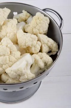 Cauliflower florets in a colander Stock Photos