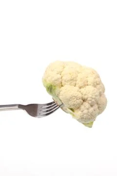 Cauliflower on a fork isolated against a white background Stock-Fotos