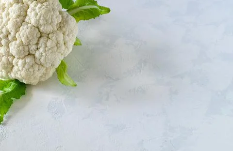 Cauliflower head on a light background Stock Photos