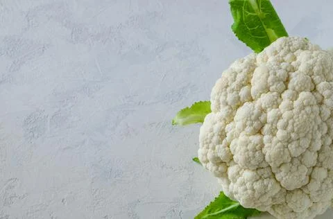 Cauliflower head on a light background Stock Photos