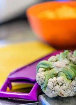 Cauliflower Laying on Kitchen Table Фото