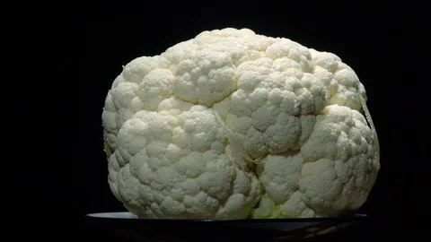Cauliflower in rotation on black background. Stock Footage 98763156