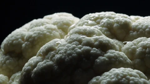 Cauliflower in rotation on black background. Stock Footage 98763379