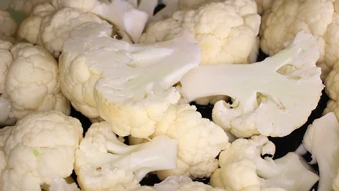 Cauliflower slices on rotating plate Stock Footage 98388970